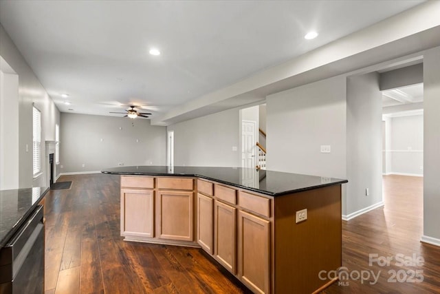 4095 Harmattan Dr, Denver, NC 28037 - kitchen featuring ceiling fan, dark wood-style floors, dishwasher, a kitchen island, and open floor plan