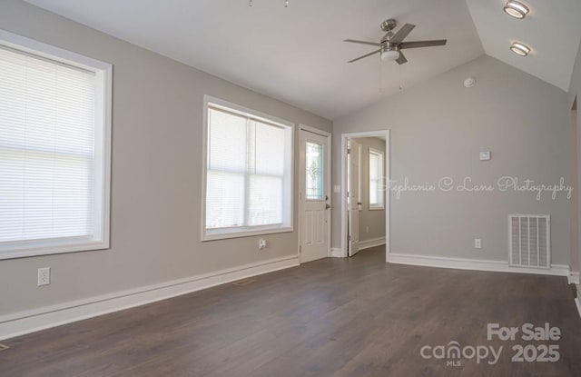728 Morningside Dr, Mount Holly, NC 28120 - spare room featuring ceiling fan, dark wood-type flooring, lofted ceiling, and baseboards