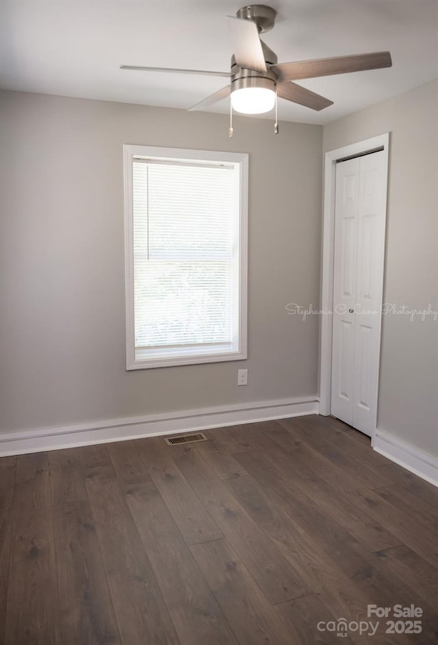 728 Morningside Dr, Mount Holly, NC 28120 - unfurnished room with wood finished floors, a ceiling fan, and baseboards