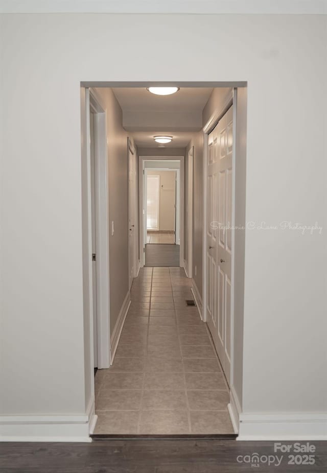 728 Morningside Dr, Mount Holly, NC 28120 - hall with baseboards and tile patterned floors