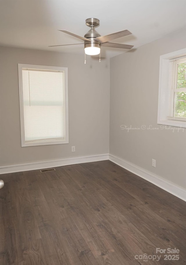 728 Morningside Dr, Mount Holly, NC 28120 - empty room featuring ceiling fan, dark wood-type flooring, and baseboards