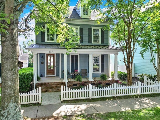 436 Third Baxter St, Fort Mill, SC 29708 - view of front of home featuring covered porch, a standing seam roof, metal roof, and a fenced front yard