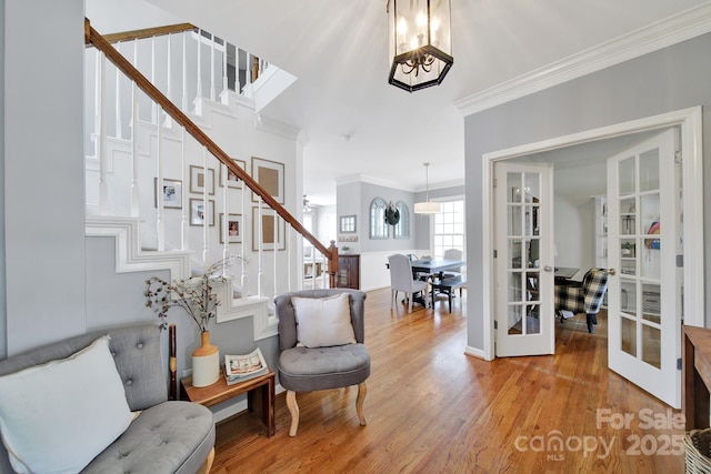 436 Third Baxter St, Fort Mill, SC 29708 - living area with french doors, stairs, a chandelier, crown molding, and wood finished floors