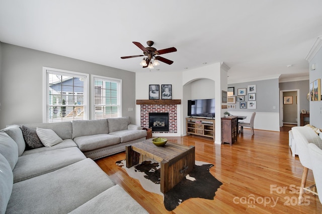 436 Third Baxter St, Fort Mill, SC 29708 - living room with a fireplace, ceiling fan, light wood-type flooring, and crown molding