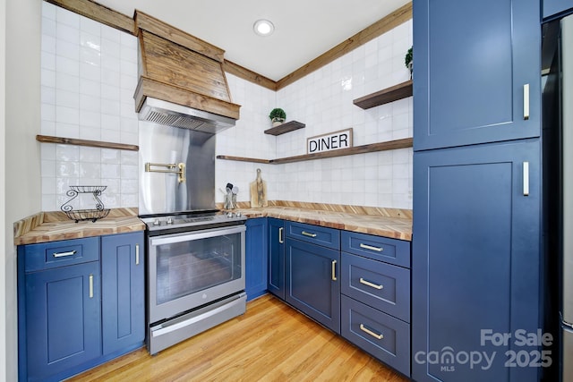 436 Third Baxter St, Fort Mill, SC 29708 - kitchen featuring butcher block counters, blue cabinets, electric range, tasteful backsplash, and recessed lighting