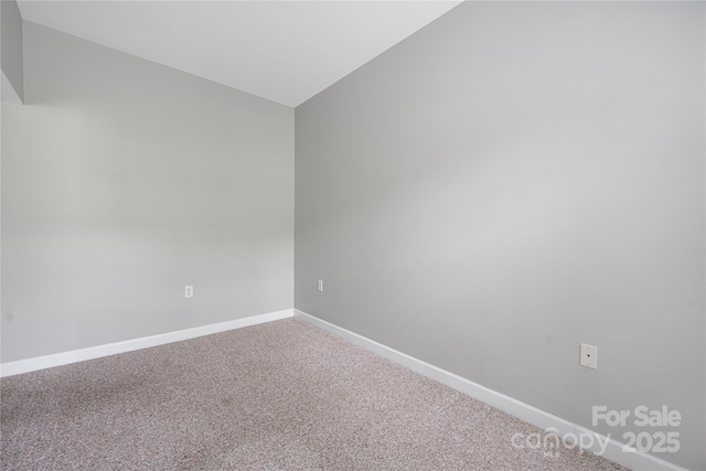 17111 Doe Valley Ct, Cornelius, NC 28031 - carpeted spare room with baseboards and vaulted ceiling