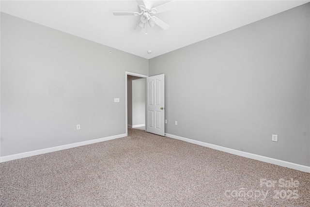 17111 Doe Valley Ct, Cornelius, NC 28031 - spare room with carpet floors, a ceiling fan, and baseboards