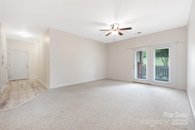 17111 Doe Valley Ct, Cornelius, NC 28031 - spare room featuring a ceiling fan, light colored carpet, and baseboards