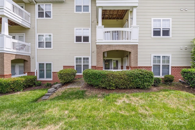 17111 Doe Valley Ct, Cornelius, NC 28031 - back of house featuring brick siding and a lawn