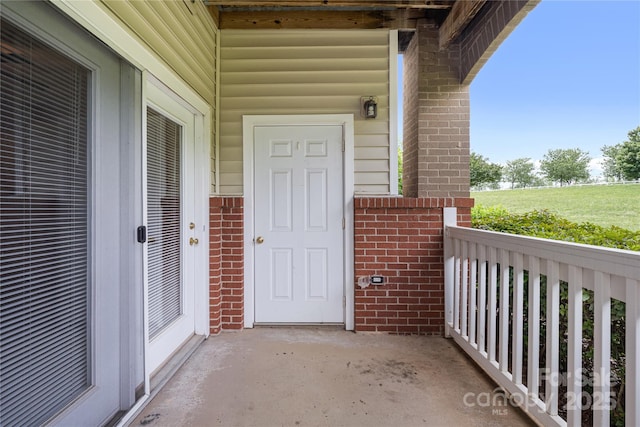 17111 Doe Valley Ct, Cornelius, NC 28031 - doorway to property with brick siding