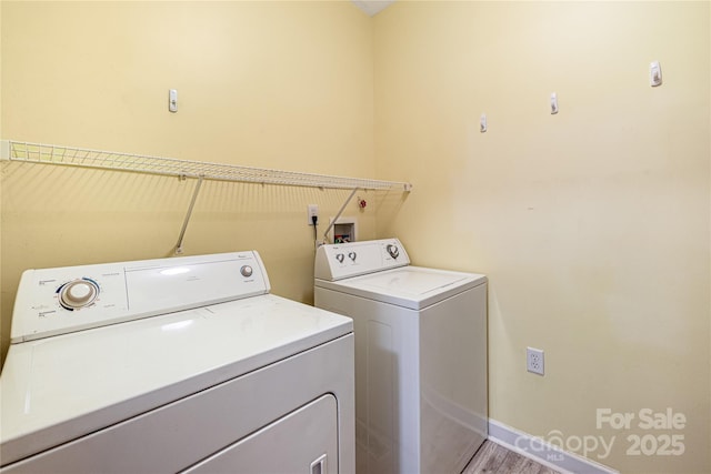 17111 Doe Valley Ct, Cornelius, NC 28031 - laundry room with independent washer and dryer, baseboards, and light wood finished floors