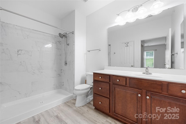17111 Doe Valley Ct, Cornelius, NC 28031 - full bathroom featuring toilet, vanity, a shower, and wood finished floors