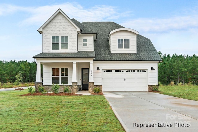 craftsman inspired home with concrete driveway, a front yard, stone siding, and roof with shingles
