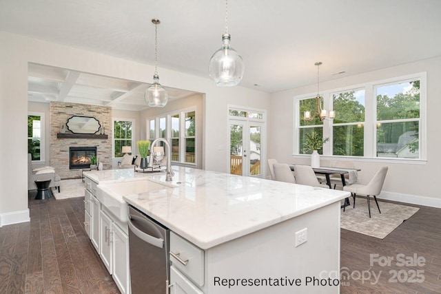 kitchen featuring dishwasher, baseboards, dark wood-style floors, open floor plan, and coffered ceiling