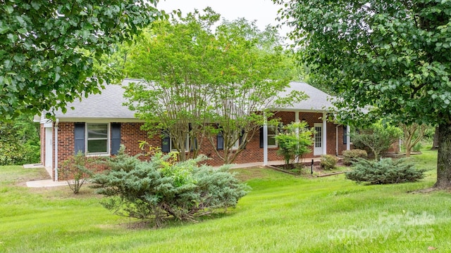 4306 Joplin Rd, Hudson, NC 28638 - view of front facade with brick siding, roof with shingles, and a front lawn