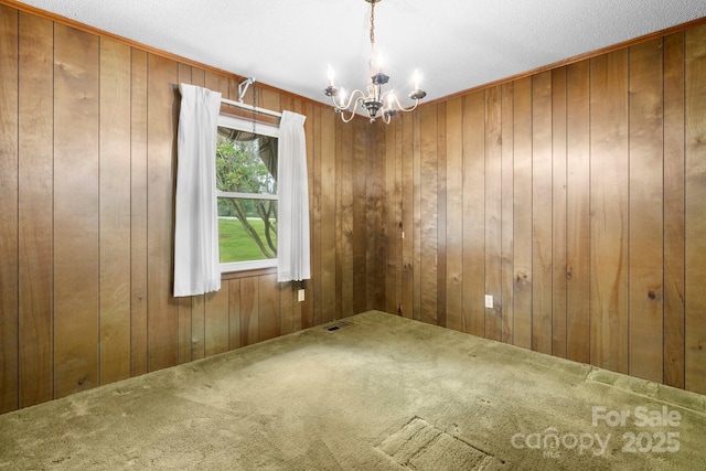 4306 Joplin Rd, Hudson, NC 28638 - carpeted spare room with a chandelier and wood walls