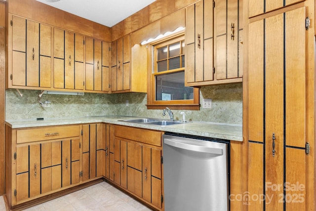 4306 Joplin Rd, Hudson, NC 28638 - kitchen featuring stainless steel dishwasher, a sink, light countertops, and decorative backsplash