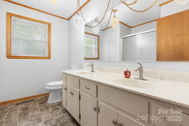 4306 Joplin Rd, Hudson, NC 28638 - bathroom featuring baseboards, toilet, crown molding, a stall shower, and double vanity