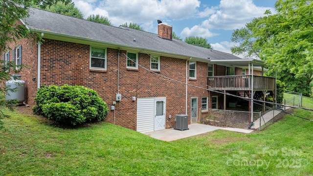 4306 Joplin Rd, Hudson, NC 28638 - back of property with a chimney, brick siding, a patio area, and a yard