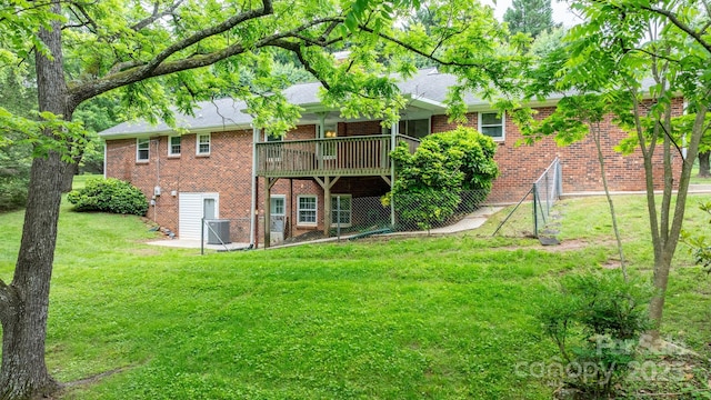 4306 Joplin Rd, Hudson, NC 28638 - back of property featuring brick siding, a yard, cooling unit, a deck, and roof with shingles