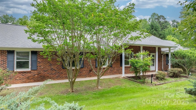 4306 Joplin Rd, Hudson, NC 28638 - view of front of house with brick siding, a shingled roof, and a front yard