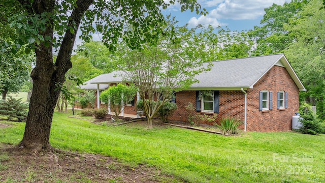 4306 Joplin Rd, Hudson, NC 28638 - view of front of property with brick siding, a front lawn, and roof with shingles
