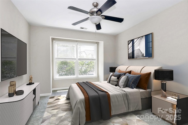 bedroom with a ceiling fan, baseboards, and light carpet