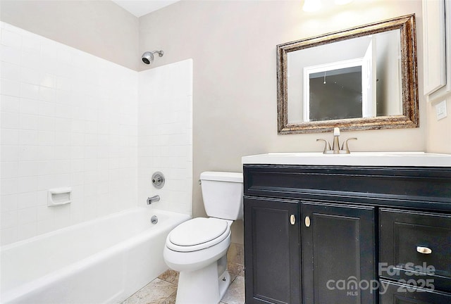 full bathroom featuring toilet, vanity, and  shower combination