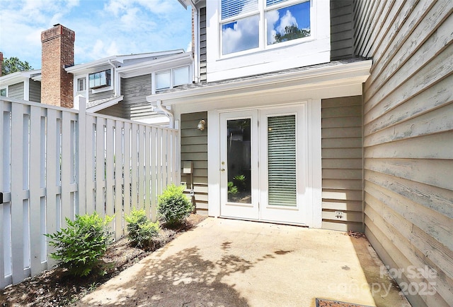 view of patio / terrace featuring fence