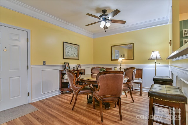 214 Appeldoorn Cir, Asheville, NC 28803 - dining area featuring ceiling fan, ornamental molding, wood finished floors, and wainscoting