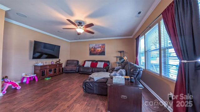 living area with dark wood finished floors, a ceiling fan, ornamental molding, and baseboards