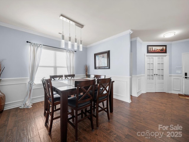 5003 Singletree Ln, Indian Trail, NC 28079 - dining room with dark wood-style flooring, crown molding, a wainscoted wall, and a decorative wall