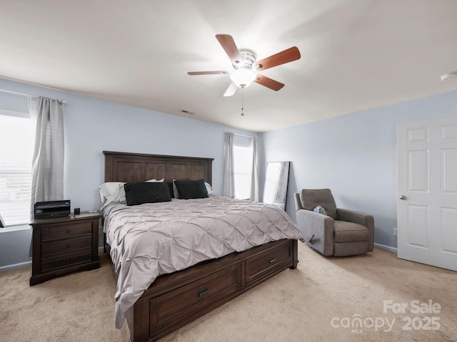 5003 Singletree Ln, Indian Trail, NC 28079 - bedroom featuring light carpet, multiple windows, and a ceiling fan