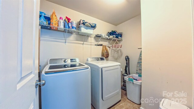 5003 Singletree Ln, Indian Trail, NC 28079 - laundry room with washer and dryer and light tile patterned flooring
