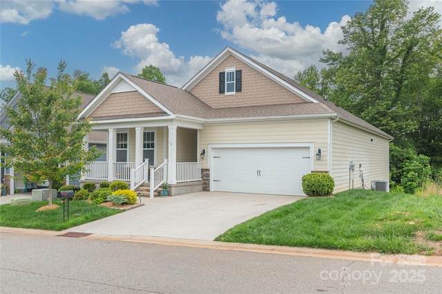 70 Rose Creek Rd, Leicester, NC 28748 - craftsman house with covered porch, an attached garage, cooling unit, and a front lawn