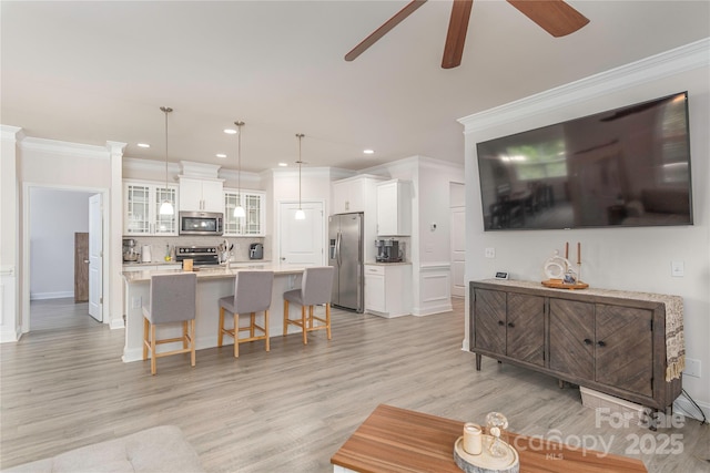 70 Rose Creek Rd, Leicester, NC 28748 - living room with a ceiling fan, ornamental molding, light wood finished floors, recessed lighting, and baseboards