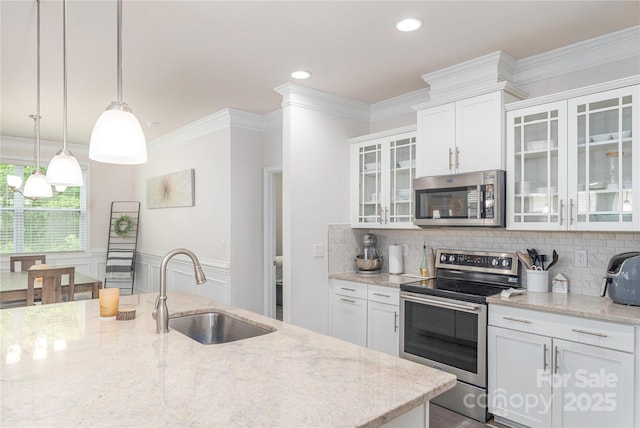 70 Rose Creek Rd, Leicester, NC 28748 - kitchen with appliances with stainless steel finishes, a sink, crown molding, white cabinetry, and light stone counters