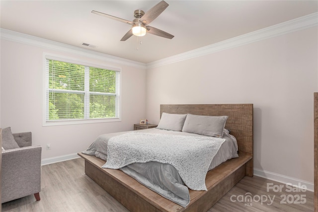 70 Rose Creek Rd, Leicester, NC 28748 - bedroom with wood finished floors, crown molding, baseboards, and a ceiling fan