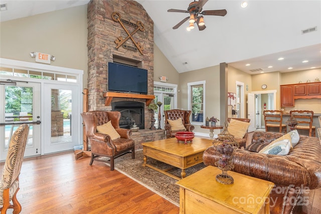 70 Rose Creek Rd, Leicester, NC 28748 - living room with high vaulted ceiling, light wood-style floors, a stone fireplace, ceiling fan, and recessed lighting