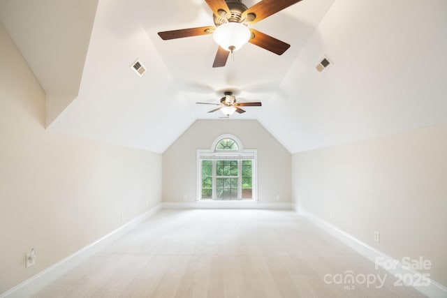 6795 Montgomery Rd, Lake Wylie, SC 29710 - additional living space with vaulted ceiling, a ceiling fan, baseboards, and light carpet