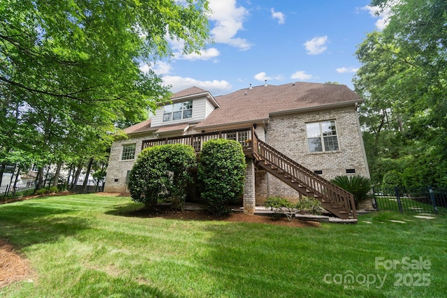 6795 Montgomery Rd, Lake Wylie, SC 29710 - back of property with brick siding, crawl space, stairway, a deck, and roof with shingles