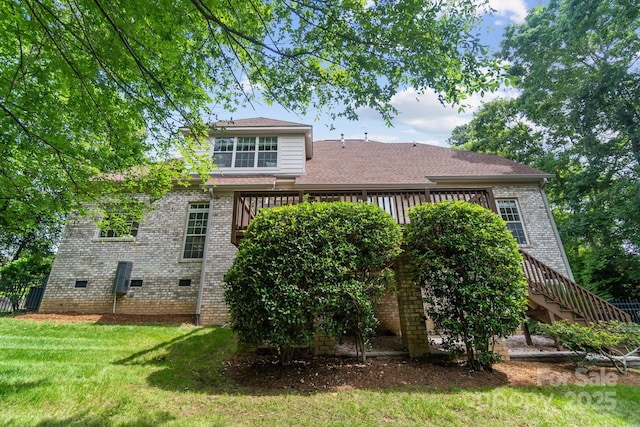 6795 Montgomery Rd, Lake Wylie, SC 29710 - rear view of house featuring brick siding, a yard, a deck, and crawl space