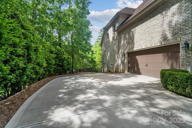 6795 Montgomery Rd, Lake Wylie, SC 29710 - view of home's exterior with brick siding, driveway, and a garage