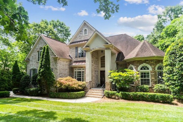 6795 Montgomery Rd, Lake Wylie, SC 29710 - french country inspired facade with brick siding, a front yard, and a shingled roof