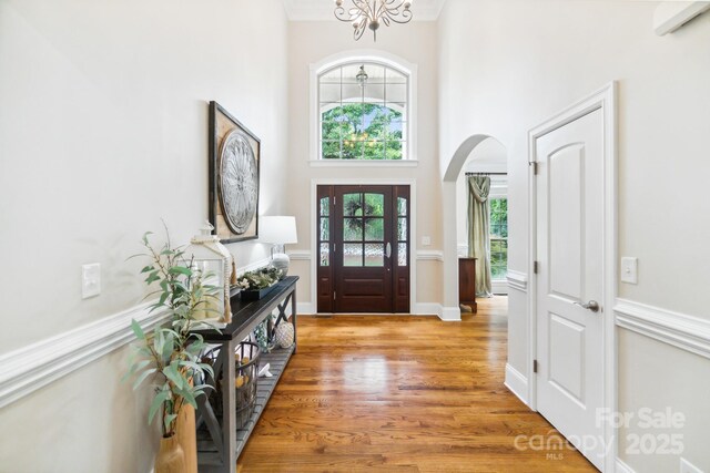 6795 Montgomery Rd, Lake Wylie, SC 29710 - entryway featuring arched walkways, a high ceiling, and light wood finished floors