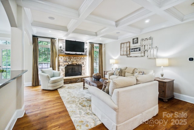 6795 Montgomery Rd, Lake Wylie, SC 29710 - living room with beamed ceiling, baseboards, a stone fireplace, plenty of natural light, and wood finished floors