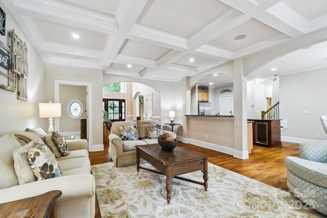 6795 Montgomery Rd, Lake Wylie, SC 29710 - living room featuring arched walkways, wood finished floors, coffered ceiling, recessed lighting, and beam ceiling