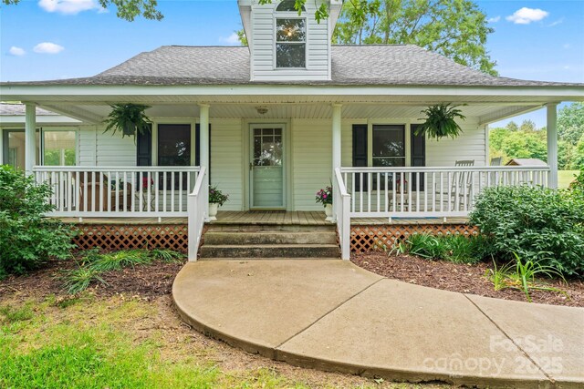 2315 Lanesboro Rd, Marshville, NC 28103 - view of front facade with a shingled roof and covered porch