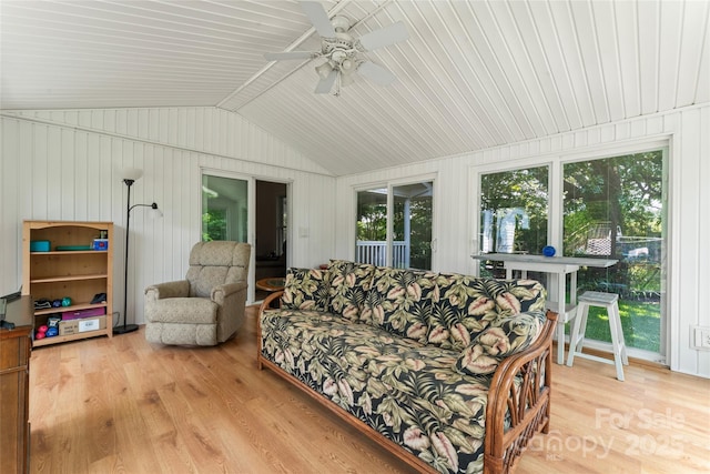 2315 Lanesboro Rd, Marshville, NC 28103 - living area with light wood finished floors, vaulted ceiling, ceiling fan, and wood walls