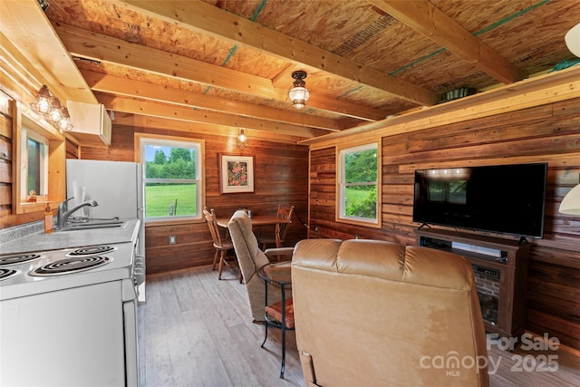 2315 Lanesboro Rd, Marshville, NC 28103 - living area featuring wooden ceiling with exposed beams, light wood-style flooring, and wood walls